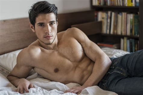 Shirtless Male Model Lying Alone On His Bed Stock Image Image Of Good Camera 70138879