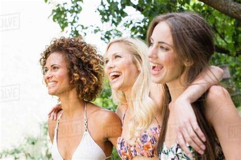 Smiling Women Standing Together Stock Photo Dissolve