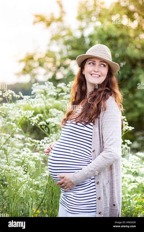 Beautiful Pregnant Women Holding Her Belly Summer Nature Stock Photo