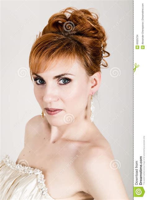 Beautiful Young Redhead Bride Wearing White Wedding Dress With Professional Make Up And