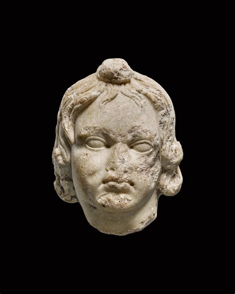 A Roman Marble Head Of A Boy Or Eros Circa 1st2nd Century Ad