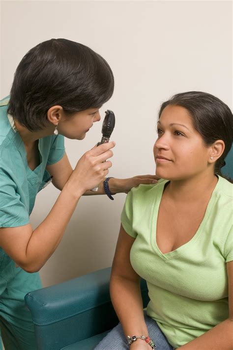Free Photos A Female Doctor Examining A Patient Peopleshot