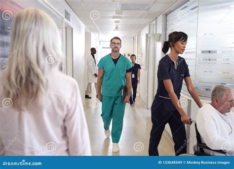 Busy Hospital Corridor With Medical Staff And Patients Stock Image