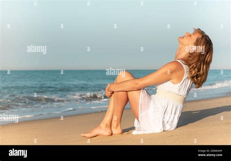 Mature Woman Enjoying Herself On The Beach Stock Photo Alamy