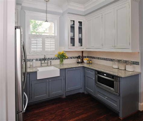 Clean lines and the ability to coordinate with nearly any home makes them a very attractive option. White top cabinets, dark bottom cabinets | homey | Pinterest