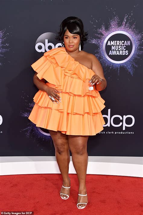 Lizzo Poses Up A Storm In Red Bodysuit And Blouse After Reflecting On Her Road To Success