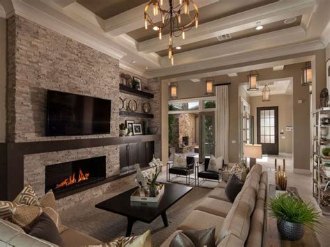 Cushiony grey bedclothes match a grey bedroom chair. 27 Beautiful Earth Tone Living Room Designs - Designing Idea