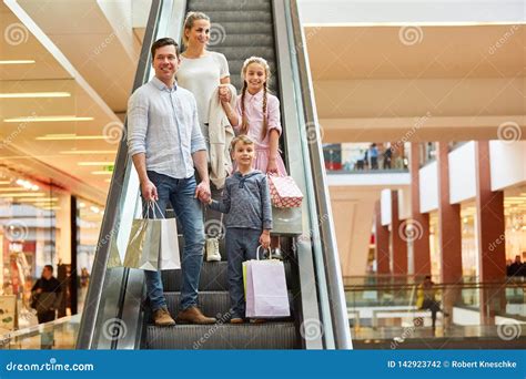 Happy Family in the Shopping Mall Stock Photo - Image of happy, parents