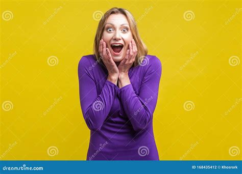 unbelievable news portrait of happy amazed woman looking shocked by sudden great news indoor
