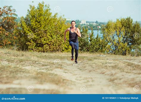 Running Sport Man Runner Sprinting Outdoor In Scenic Nature Stock