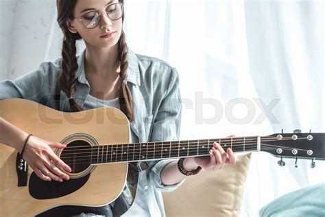 Attractive Teen Girl Playing Acoustic Guitar Stock Image Colourbox