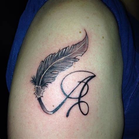 Often, these designs are used to make armband or sleeve tattoos. A Letter and Peacock Feather Armband Tattoos - SheIdeas