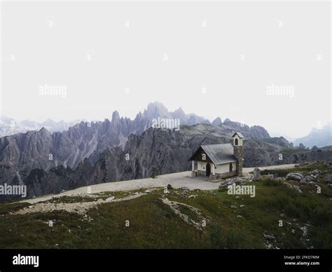 Alpine Panorama Of Cappella Degli Alpini Mountain Chapel In Front Of