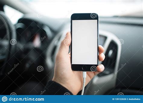 The mockup displays a highly realistic design. Close-up, Hand Of Man Holding Smartphone With Mockup On ...