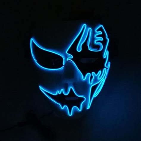 An Illuminated Mask In The Dark With Blue Light