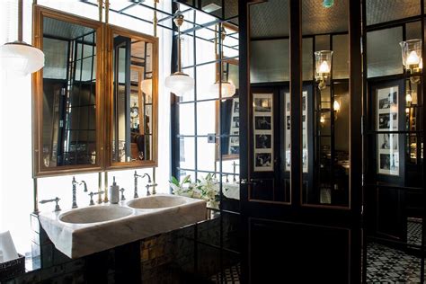 The art deco style encompasses influences from the 1920's and offers a timeless classic look. mirror + brass | Beautiful bathrooms, Public bathrooms ...