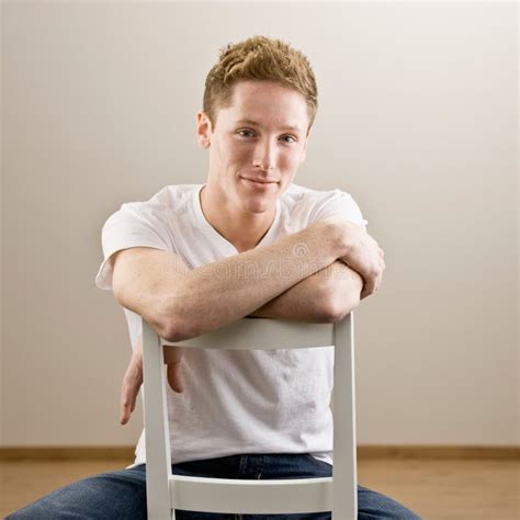 Young Man Sitting Backwards In Chair Stock Image Image Of Backward
