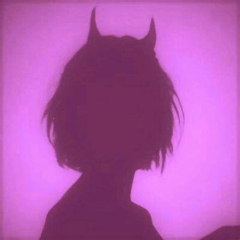 The Silhouette Of A Woman With Horns On Her Head