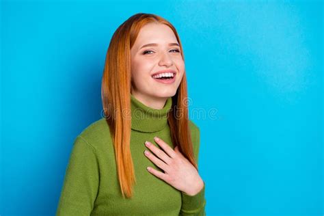 portrait of attractive cheerful delighted red haired girl lauging enjoying isolated over bright