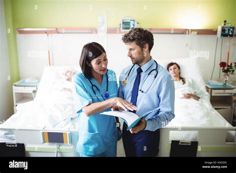 Doctor Interacting With Nurse Stock Photo Alamy