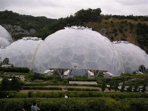 Several Large Domes Sitting Next To Each Other On Top Of A Lush Green