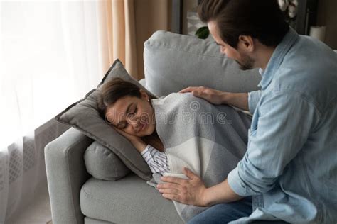 Caring Husband Take Care Of Wife Sleeping On Couch Stock Photo Image