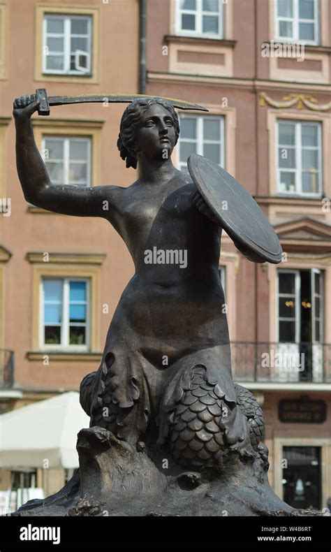 The Statue Of Syrenka The Warsaw Mermaid In The Old Town Market Place