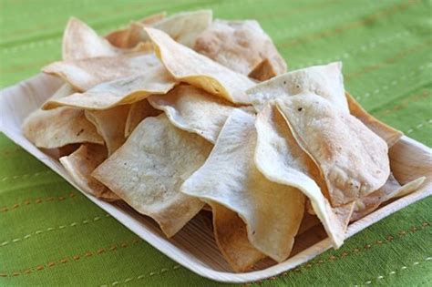 To get this complete recipe with instructions and measurements, check out my website: Homemade Baked Tortilla Chips Recipe | Two Peas & Their Pod