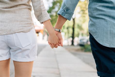 Couple Holding Hands While Walking On Pavement Hd Wallpaper Wallpaper Flare