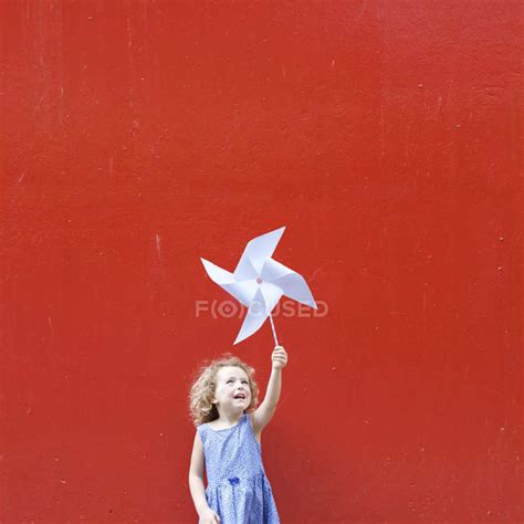 Smiling Girl Holding Pinwheel — Creativity Conceptual Stock Photo