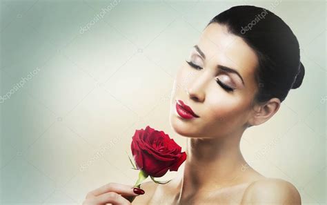 Romantic Woman Holding Red Rose On Light Background Stock Photo