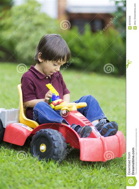 Happy Little Boy Driving A Toy Car Stock Photo Image Of Innocence