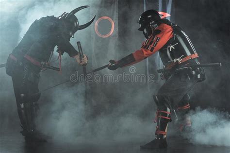 Armored Samurai Fighting With Swords Surrounded With Smoke In Front Of