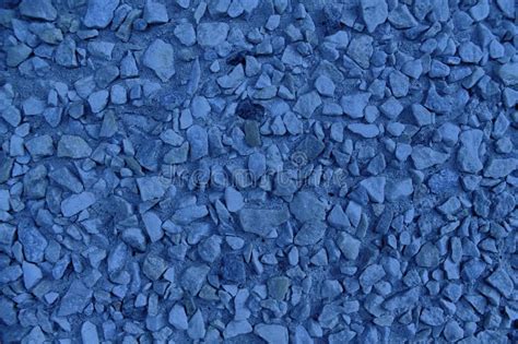 Ultra Blue Pebble Textured Surface Stone Backdrop And Boulder