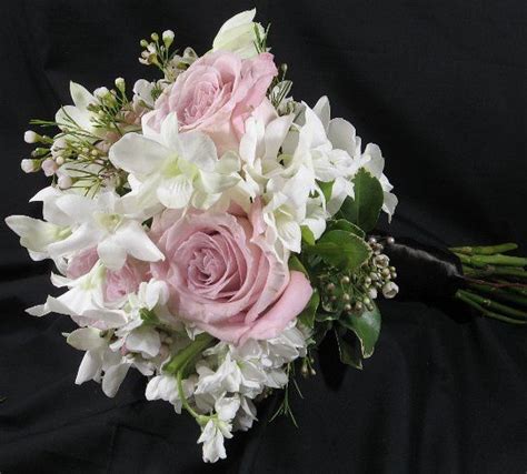 Simply Lovely Bouquet Created With Pristine And Delicate White Orchids