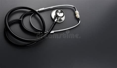 Stethoscope On Black Background Stock Photo Image Of Light Bulb