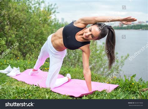 Woman Yoga Pose Her Arm Reaching Stock Photo 561817630 Shutterstock