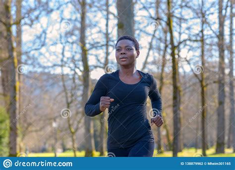 Determined Young African Woman Training In A Park Stock Photo Image