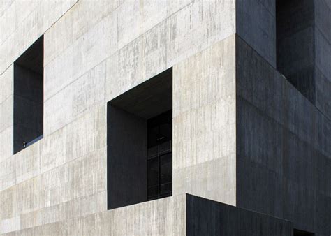 Giant Openings Puncture This Monolithic Concrete Innovation Centre