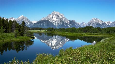 Grand Tetons Reflected In Still Water Of The Snake River At Oxbow Bend