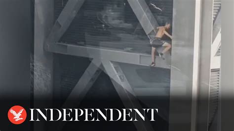 Topless Daredevil Climbs 225 Metre Tall Cheesegrater Skyscraper With No