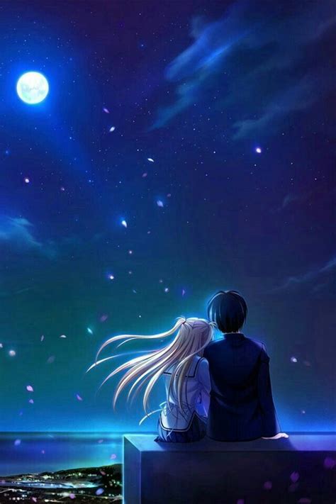 Two People Sitting On A Ledge Looking At The Night Sky With Stars And