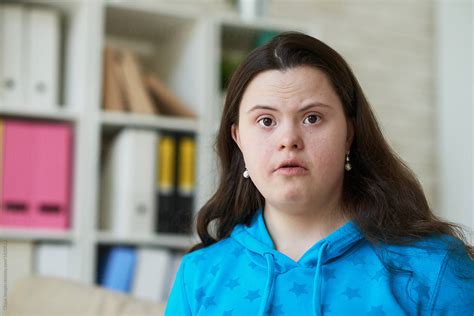 Portrait Of Woman With Down Syndrome Del Colaborador De Stocksy Clique Images Stocksy
