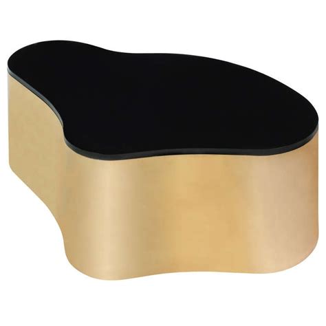 Live edge, free form teak coffee table. "Free Form Coffee Table" in Brass by Karl Springer at 1stdibs