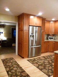 Slide out pantry beside refrigerator. Anyone have pics of fridge flanked by tall pantries?