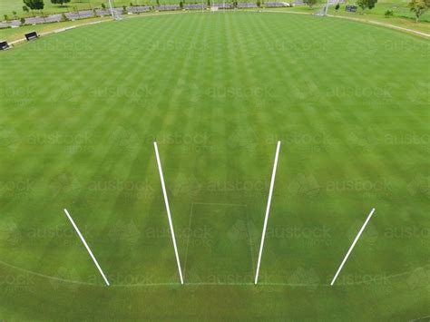 Many australian footy pitches share their grounds with cricket fields. Image of Aerial view of AFL footy field and goal posts ...
