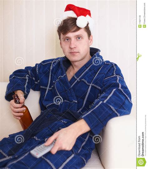 Person In Christmas Hat Sits On Sofa With Beer Stock Image Image Of People Glass 11821149