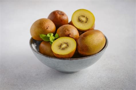 Premium Photo Yellow Kiwi Fruit In A Bowl