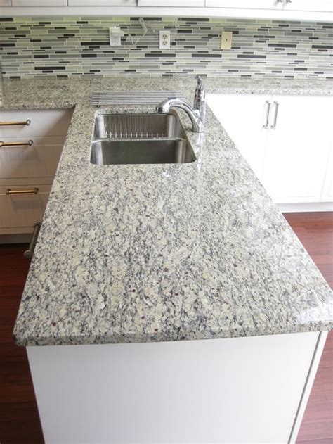 Santa cecilia granite with white cabinets and 4×4 crema imperial tumbled travertine border: Santa Cecilia Light Granite | Houzz