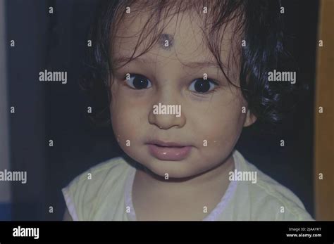 Cute Indian Baby Boy Smiling And Looking At Camera Stock Photo Alamy